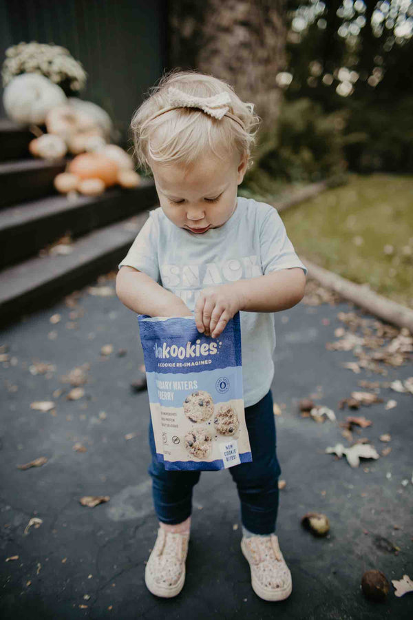 Little kid eating Kakookies blueberry cookie bites